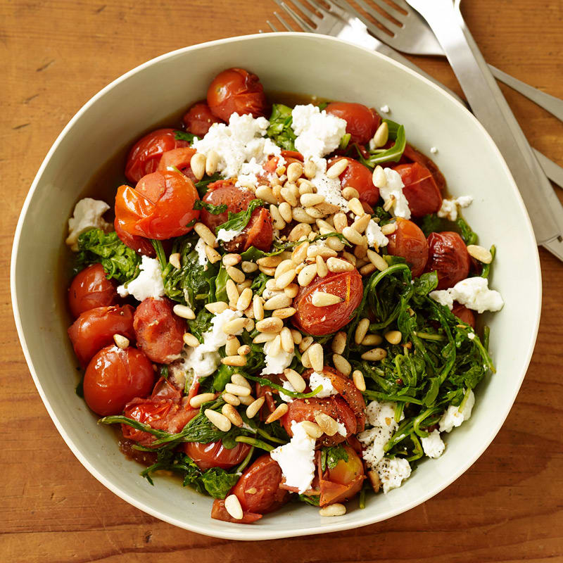Photo of Sautéed arugula & tomatoes with cheese & pine nuts by WW