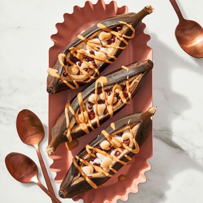 Grilled banana split boats with peanut butter sauce