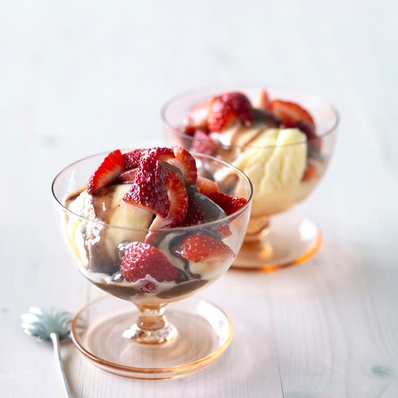 Photo of Ice-cream with strawberries and hot fudge sauce by WW