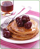 Photo of Oatmeal-Buttermilk Pancakes Topped with Cherries by WW