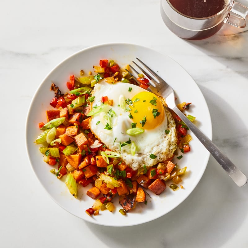 Photo of Sweet potato breakfast hash with fried eggs by Millie Peartree by WW