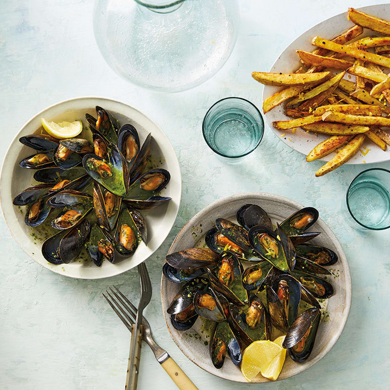 Photo of Mussels with Pesto Broth & Lemony Oven Fries by WW