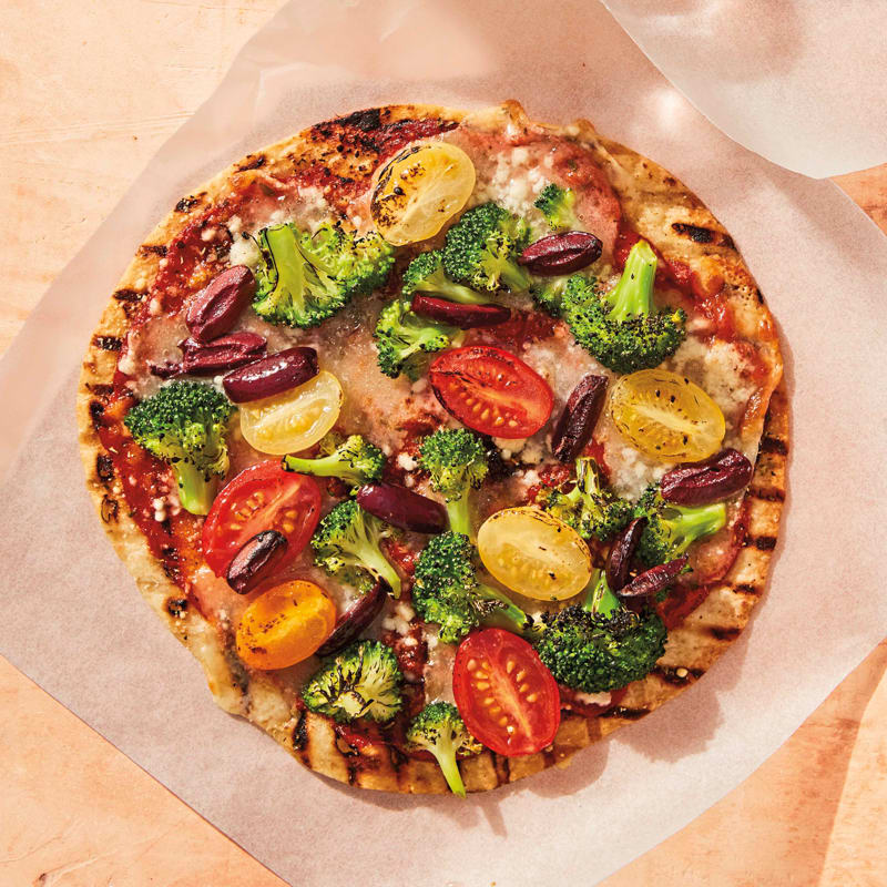 Photo of Grilled broccoli, cherry tomato, and olive pizzas by WW