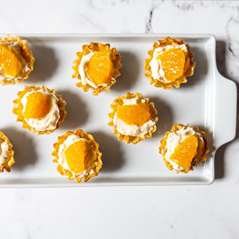 Photo of Creamy orange cheesecake tartlets by WW