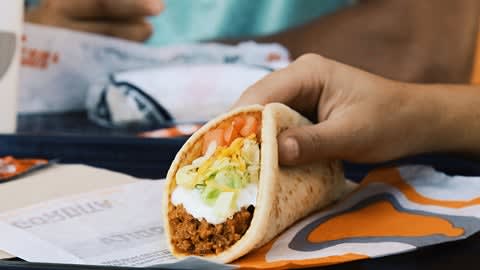 Soft ground beef taco with tomatoes, lettuce and cheese