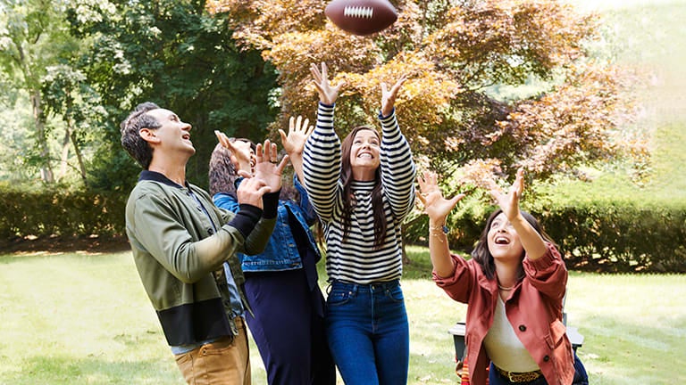 a group of people playing with a football