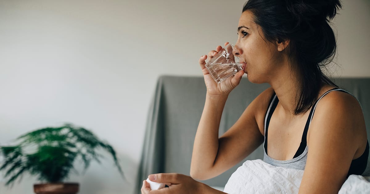 woman with diabetes drinking glass of water