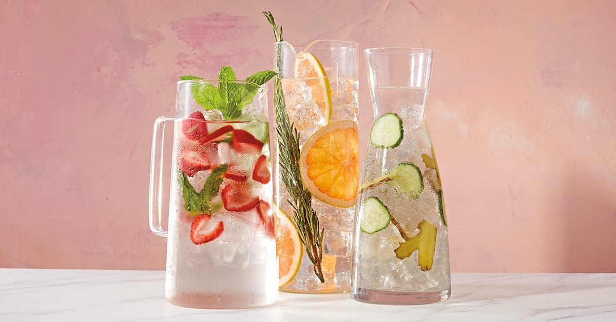 Pitchers of water with different fruits