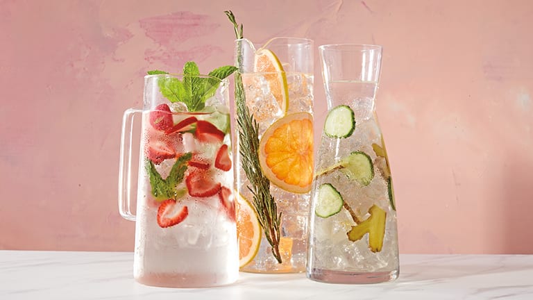 Pitchers of water with different fruits