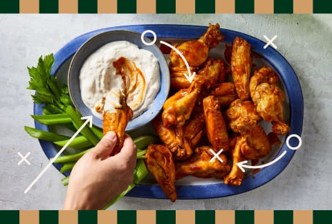 chicken wings dipped in ranch dressing