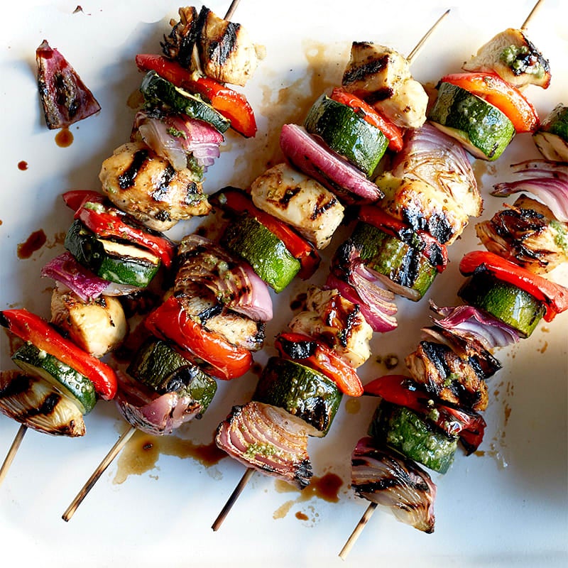 Photo of Mojo-marinated chicken and vegetable kebabs with mixed greens by WW
