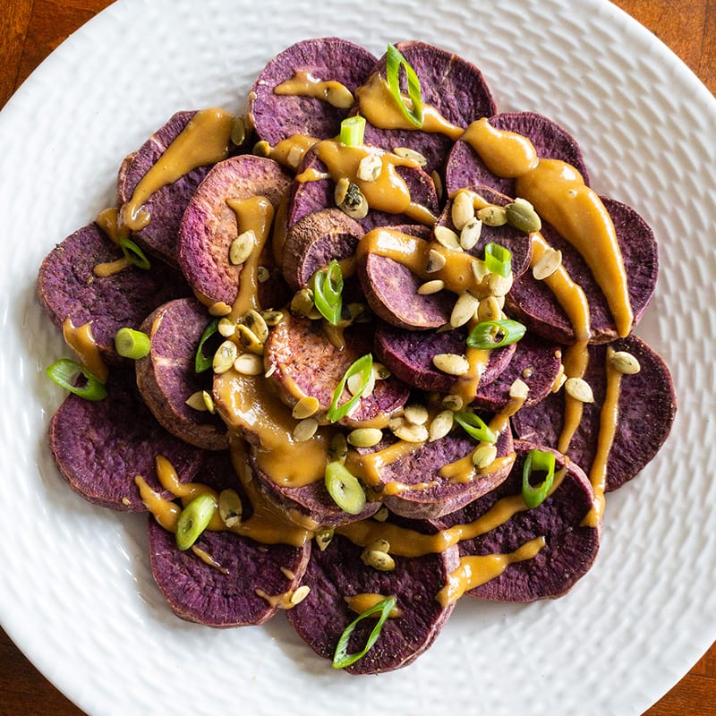 Photo of Purple Sweet Potato Slices with Tahini & Pepitas by WW
