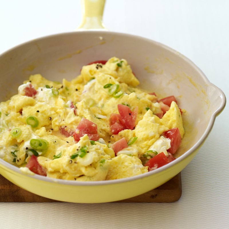 Photo of Creamy scrambled eggs with scallions and tomatoes by WW